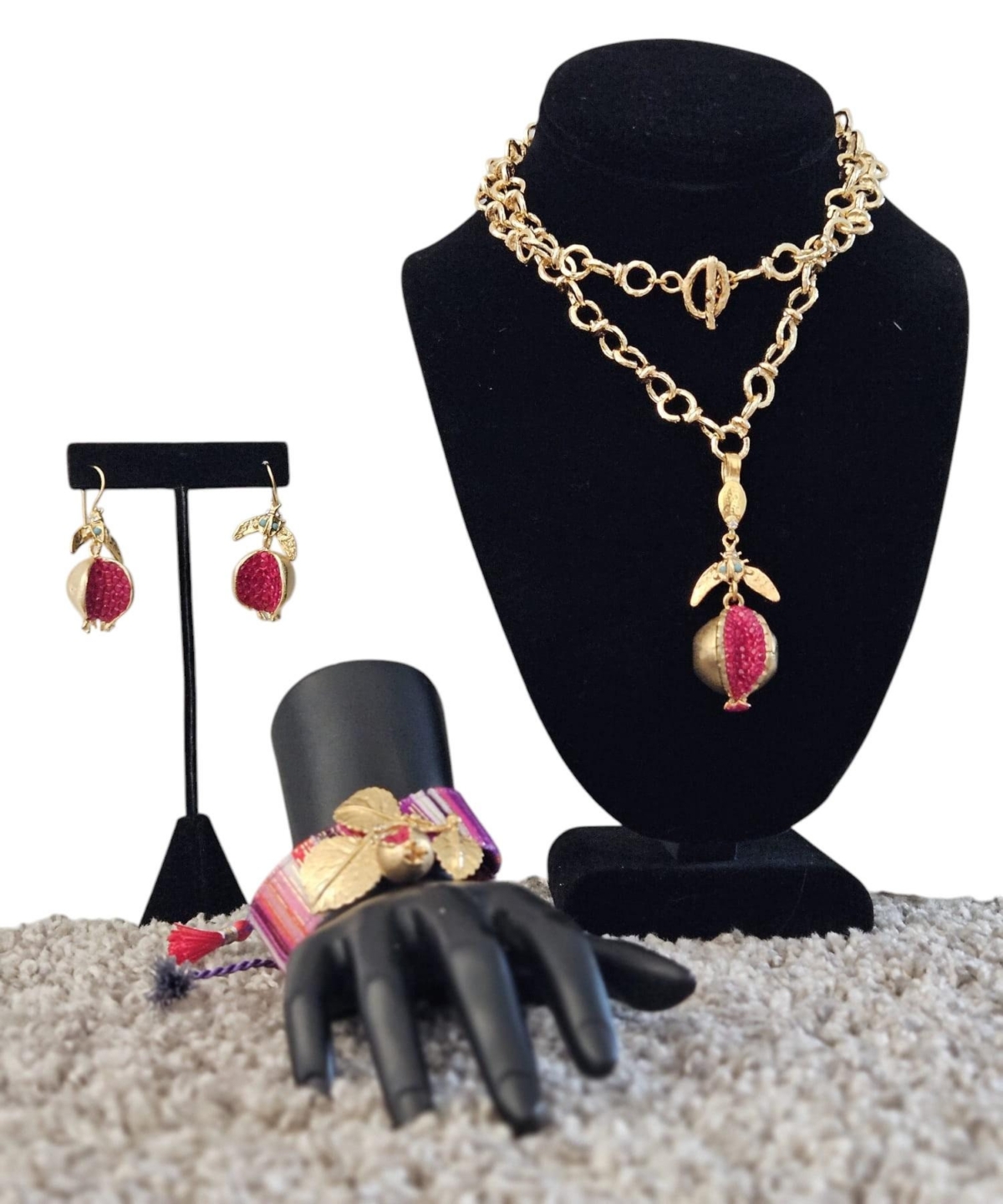 A pomegranate-themed jewelry set bracelet,necklace,and earrings combines elegance with symbolic depth,representing abundance,and love.